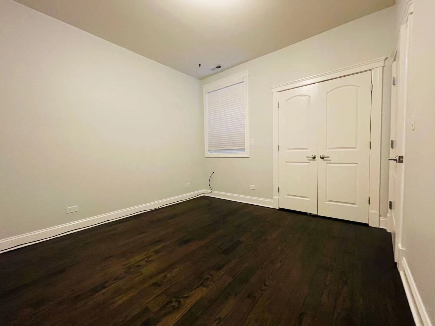 39 North Morgan Street, Unit 3 Chicago, IL 60607 - Photo 10 of 17 a view of an empty room with wooden floor