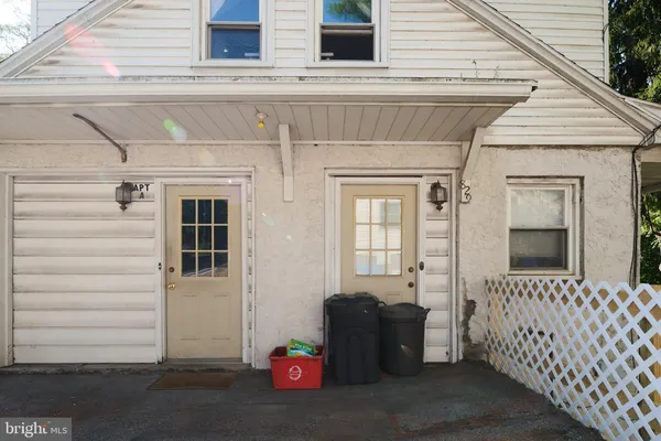a view of a house with a door and wooden floor