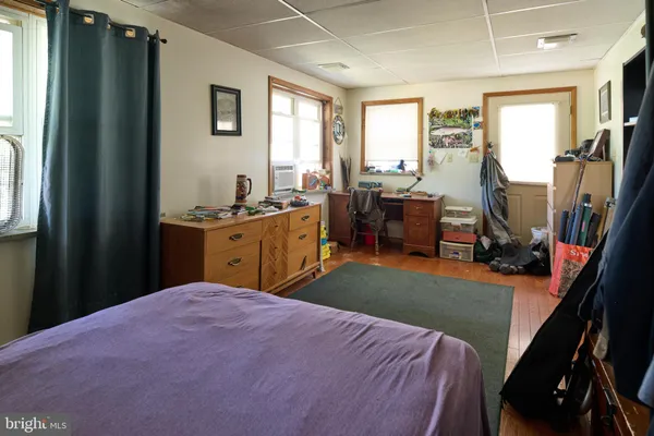 a bed room with a bed and a dresser