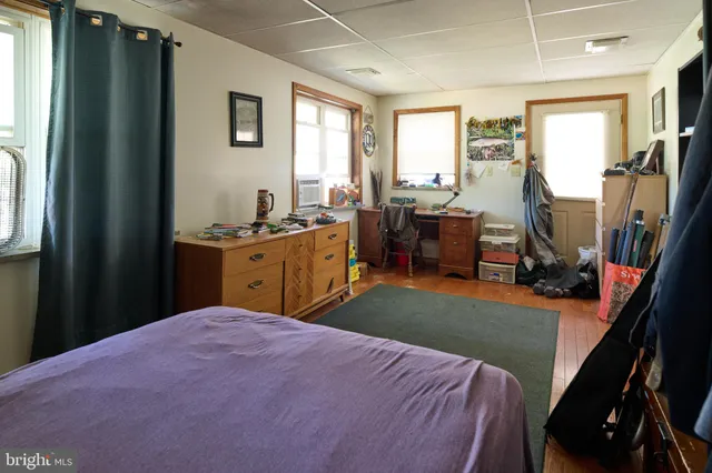 a bed room with a bed and a dresser