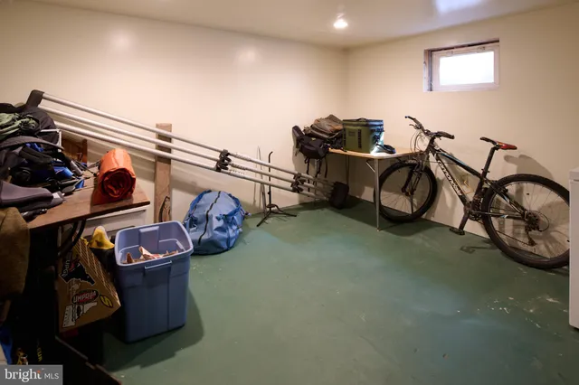 a bathroom with a white tub and shower