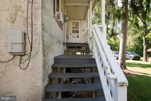 a view of a livingroom with wooden floor and a window