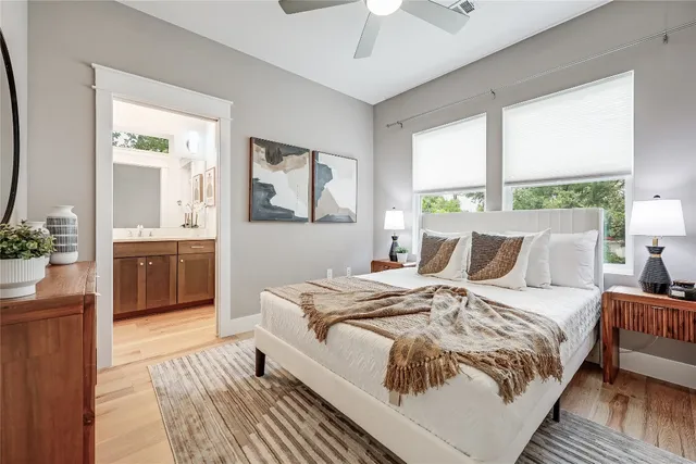 a bed sitting in a bedroom next to a window