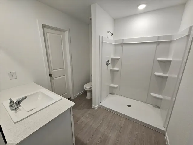 a bathroom with a bathtub sink and toilet