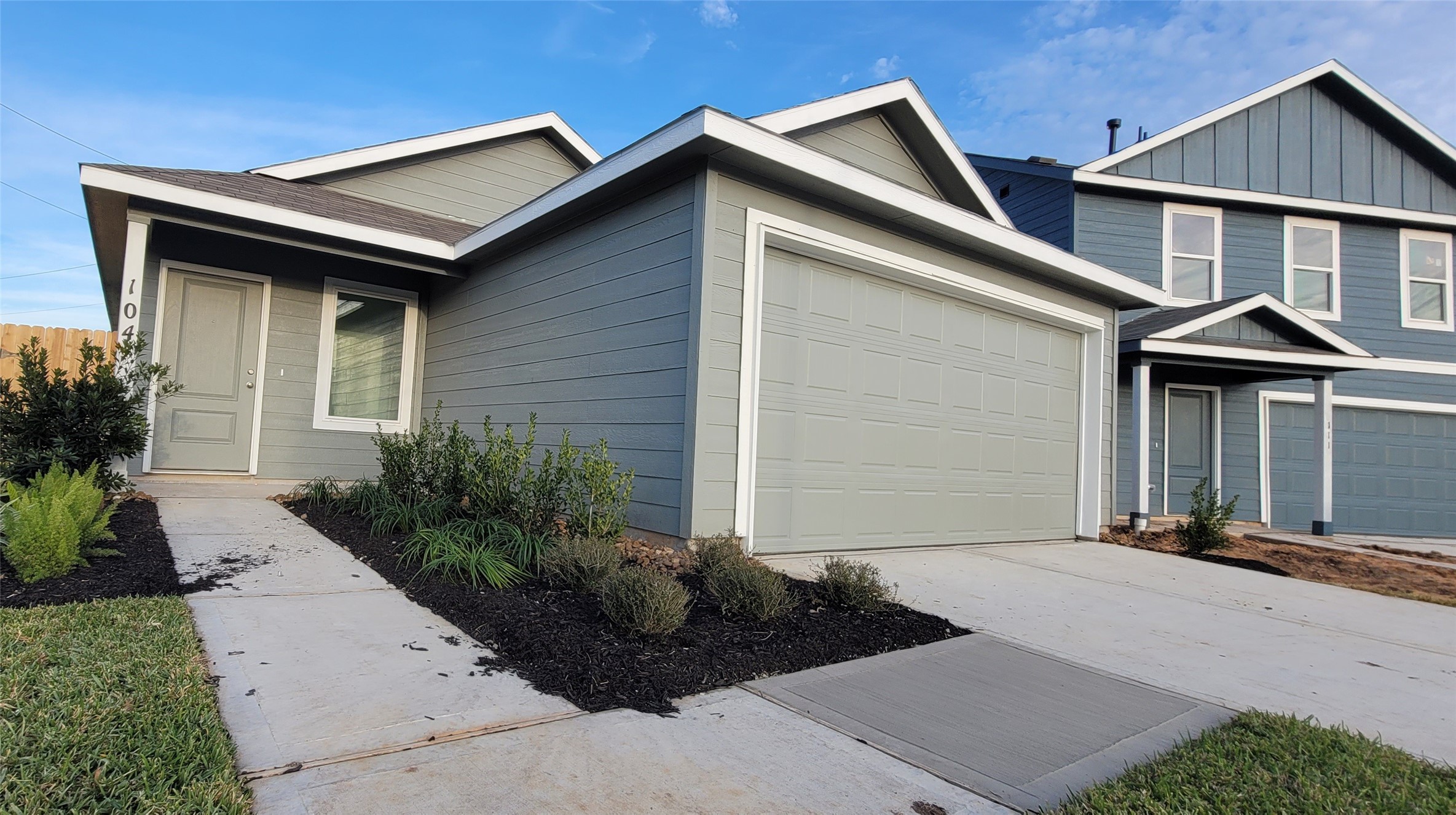 1306 Charlotte Way Wharton, TX 77488 - Photo 10 of 16 a front view of a house with a yard