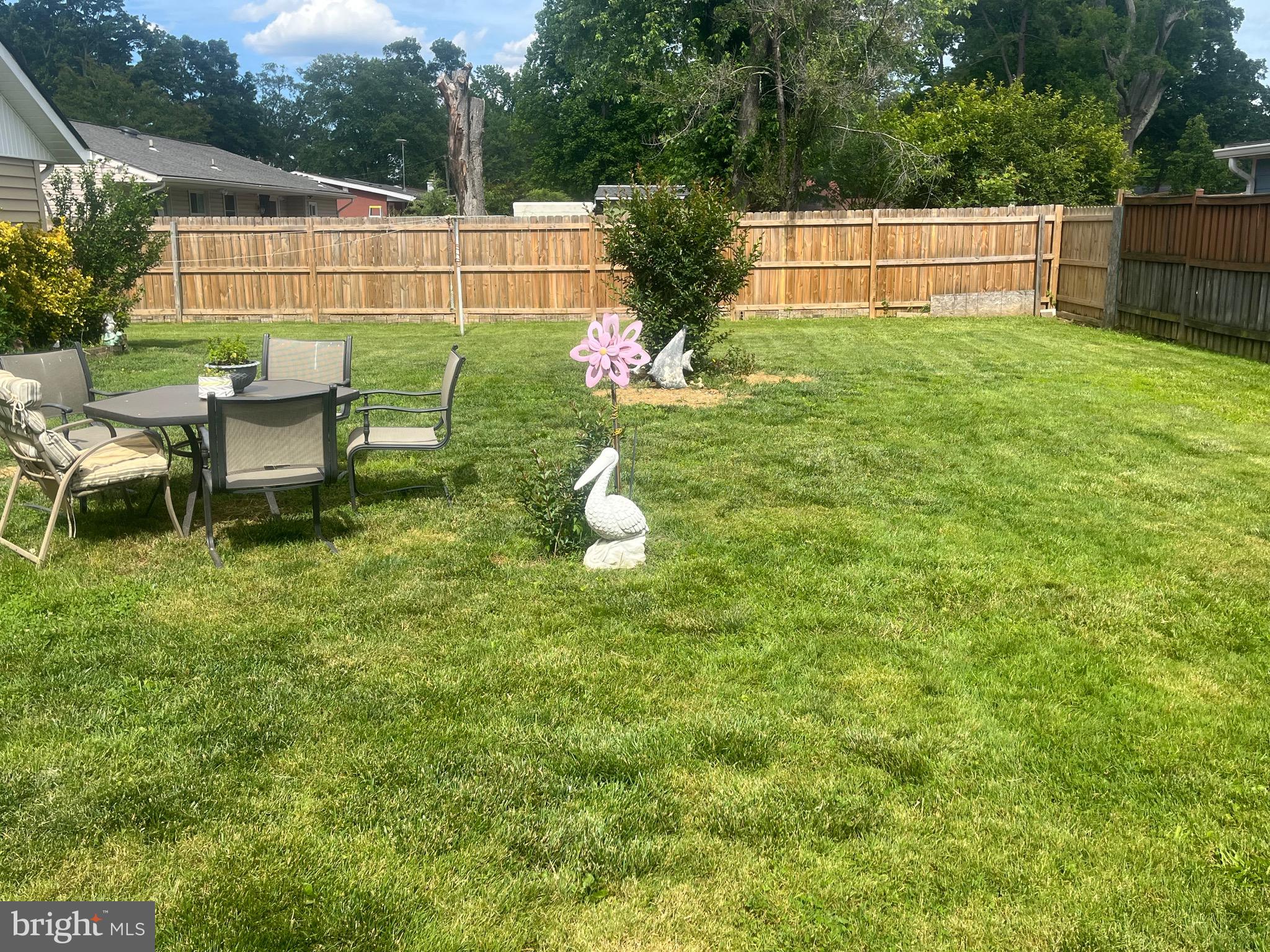 4111 Lawrence Street Alexandria, VA 22309 - Photo 11 of 42 a backyard of a house with table and chairs