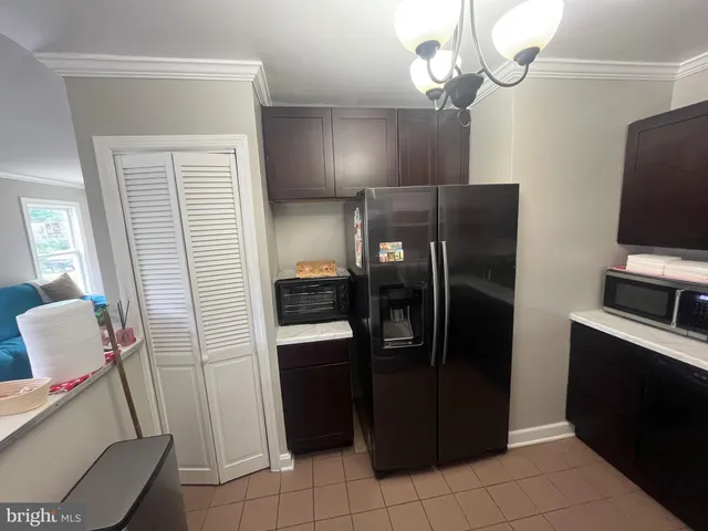 a kitchen with a sink a stove and refrigerator