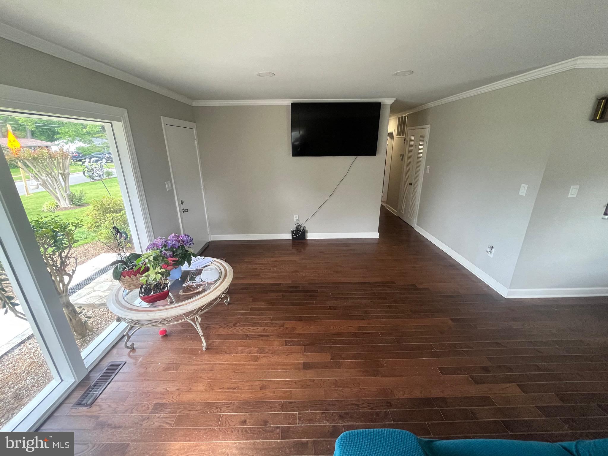4111 Lawrence Street Alexandria, VA 22309 - Photo 22 of 42 a living room with furniture and a flat screen tv
