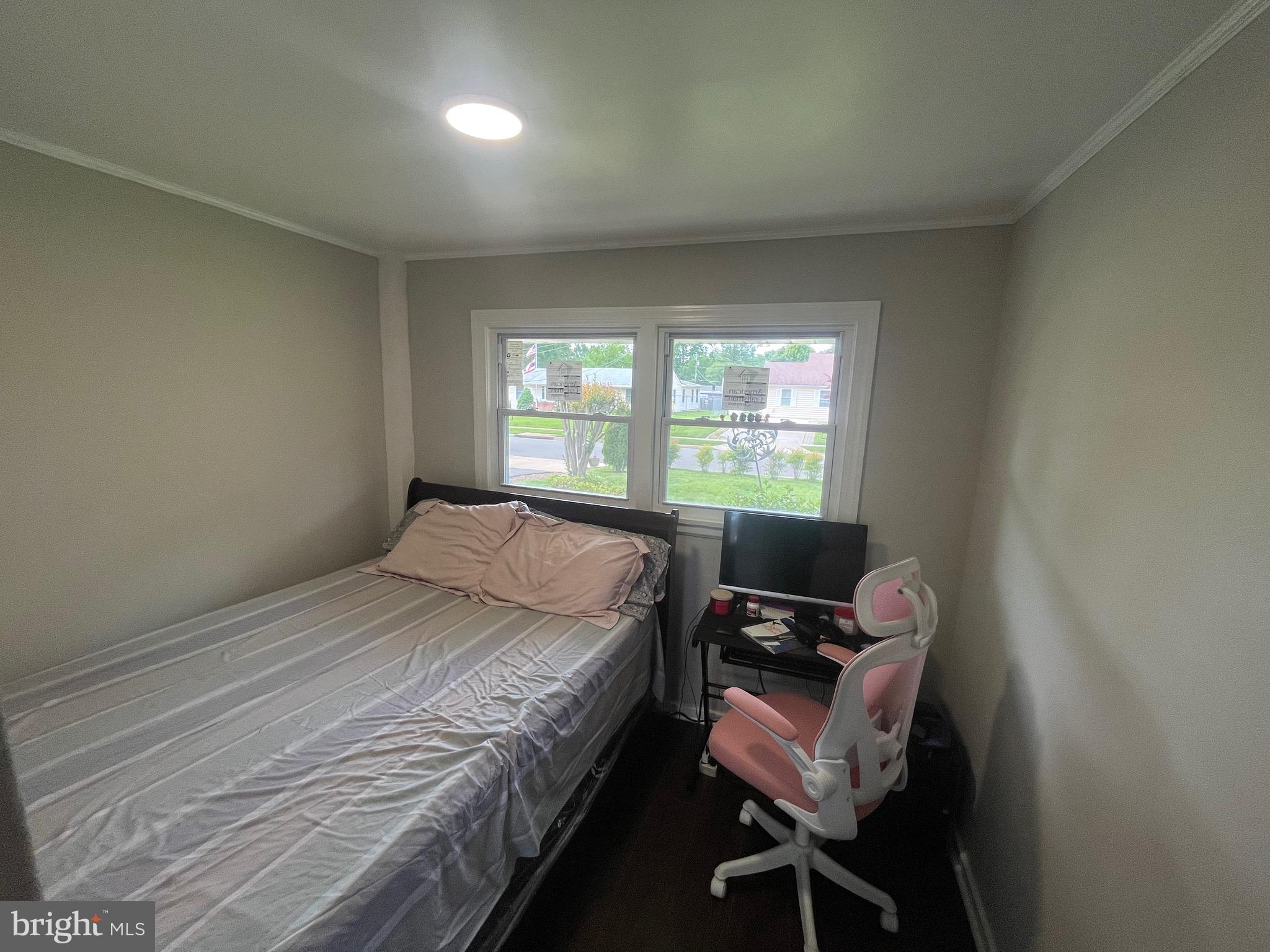 4111 Lawrence Street Alexandria, VA 22309 - Photo 25 of 42 a bedroom with a bed window and chair