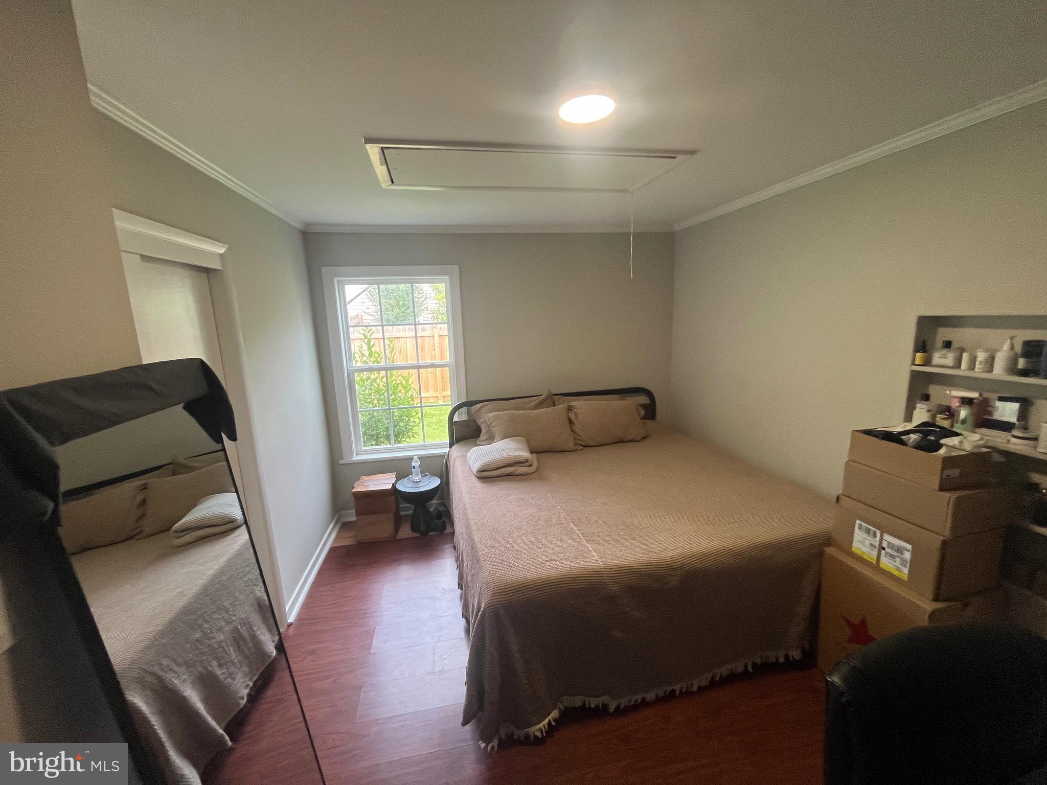 4111 Lawrence Street Alexandria, VA 22309 - Photo 31 of 42 a bedroom with a bed and wooden floor