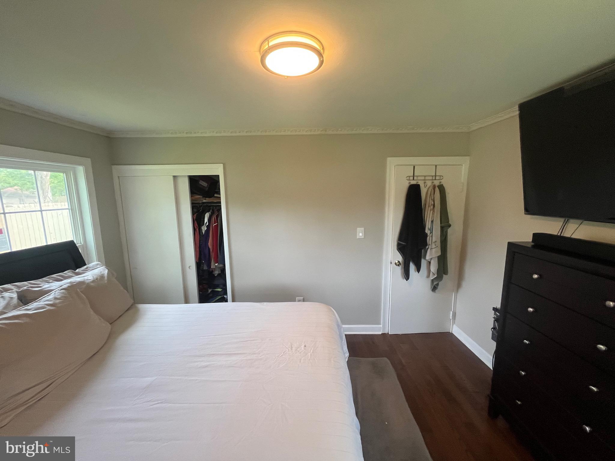 4111 Lawrence Street Alexandria, VA 22309 - Photo 32 of 42 a bedroom with a bed and a flat screen tv