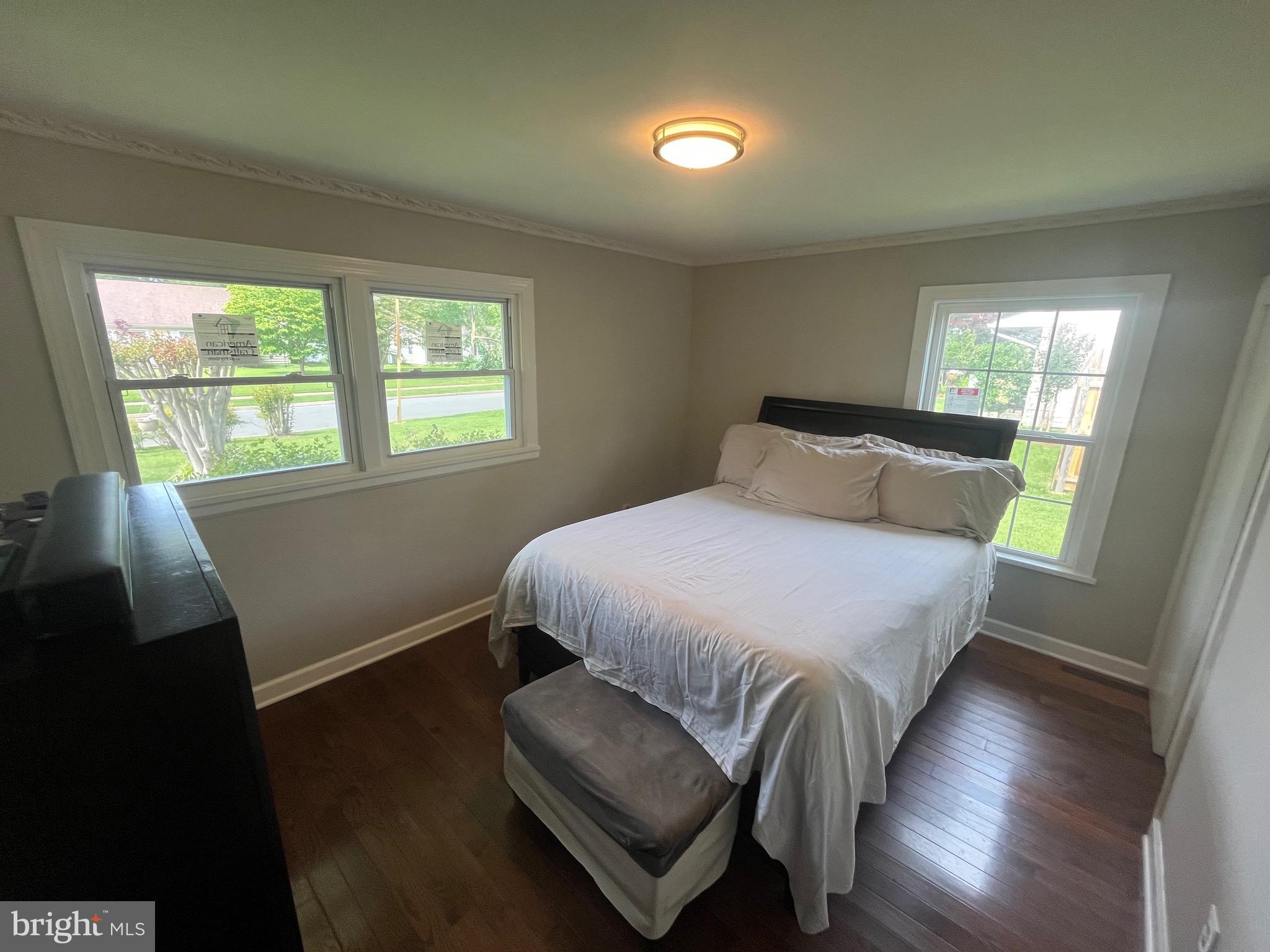 4111 Lawrence Street Alexandria, VA 22309 - Photo 33 of 42 a bedroom with a bed and wooden floor