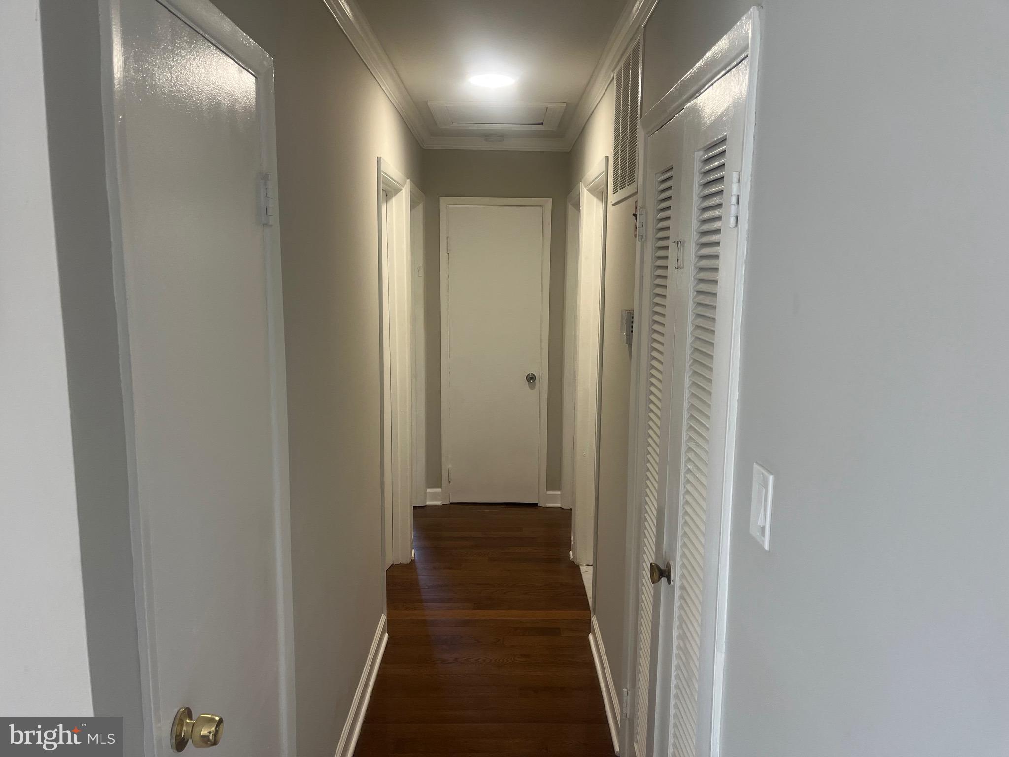 4111 Lawrence Street Alexandria, VA 22309 - Photo 34 of 42 a view of a hallway with a wooden door