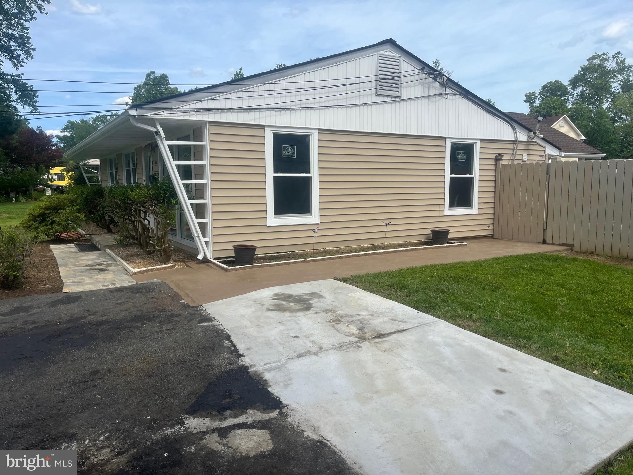 4111 Lawrence Street Alexandria, VA 22309 - Photo 36 of 42 a front view of a house with a yard and garage