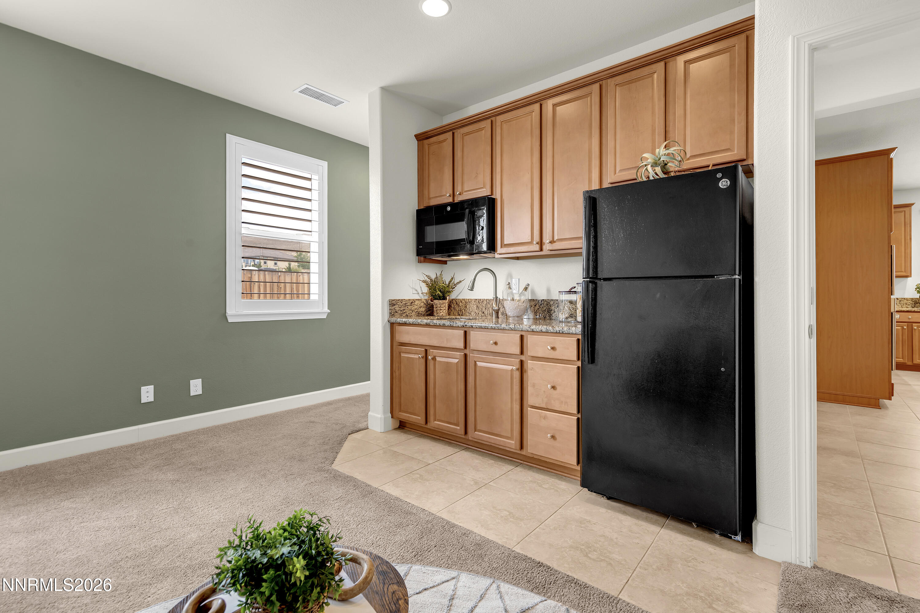 10150 Barrel Racer Drive Reno, NV 89521 - Photo 36 of 64 a kitchen with a refrigerator and a sink