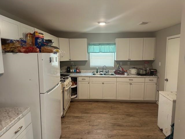 2618 Walnut Road Memphis, TN 38128 - Photo 4 of 6 a kitchen with a refrigerator a stove a sink and cabinets