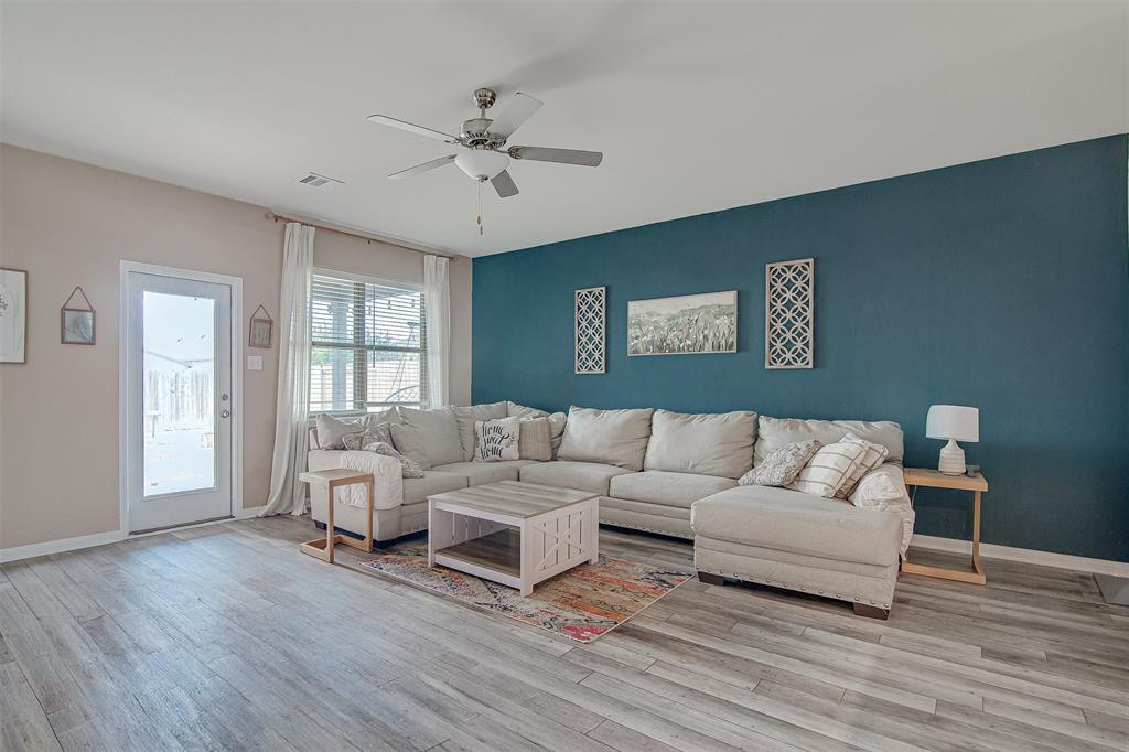 1813 Rialto Lane Crowley, TX 76036 - Photo 11 of 27 a living room with furniture and a large window