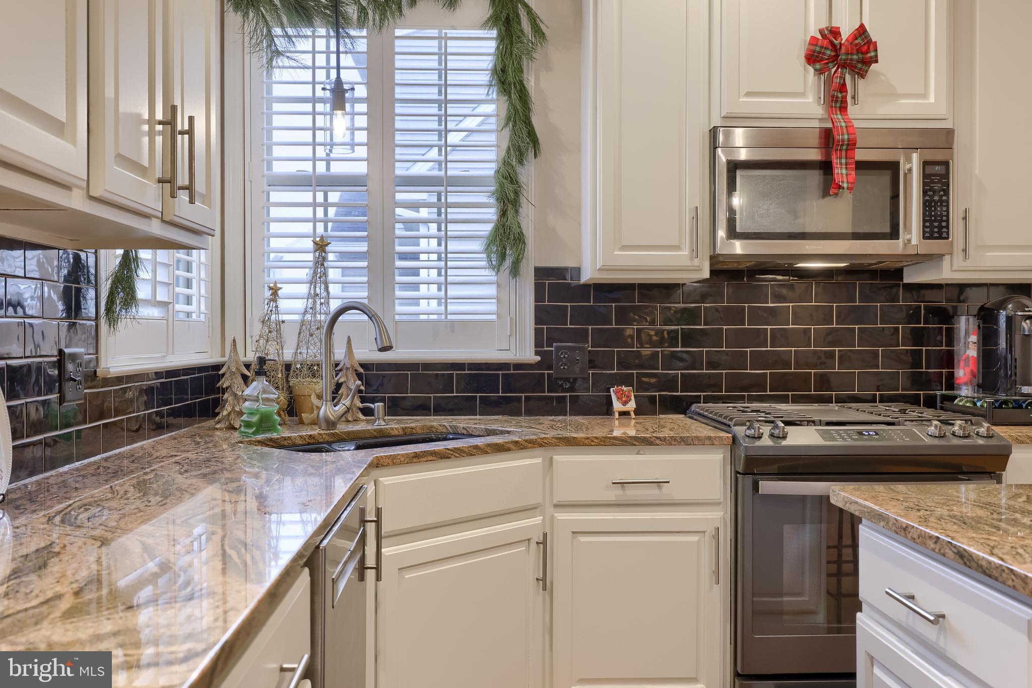 307 Bowyer Lane Lititz, PA 17543 - Photo 23 of 64 a kitchen with a sink stove and cabinets