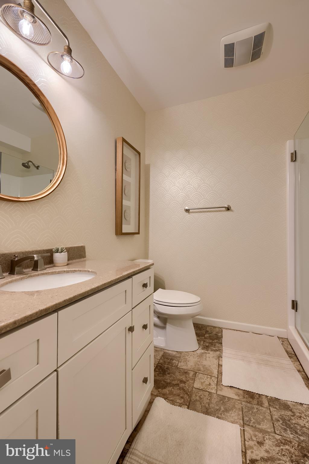 307 Bowyer Lane Lititz, PA 17543 - Photo 42 of 64 a bathroom with a granite countertop sink and a mirror