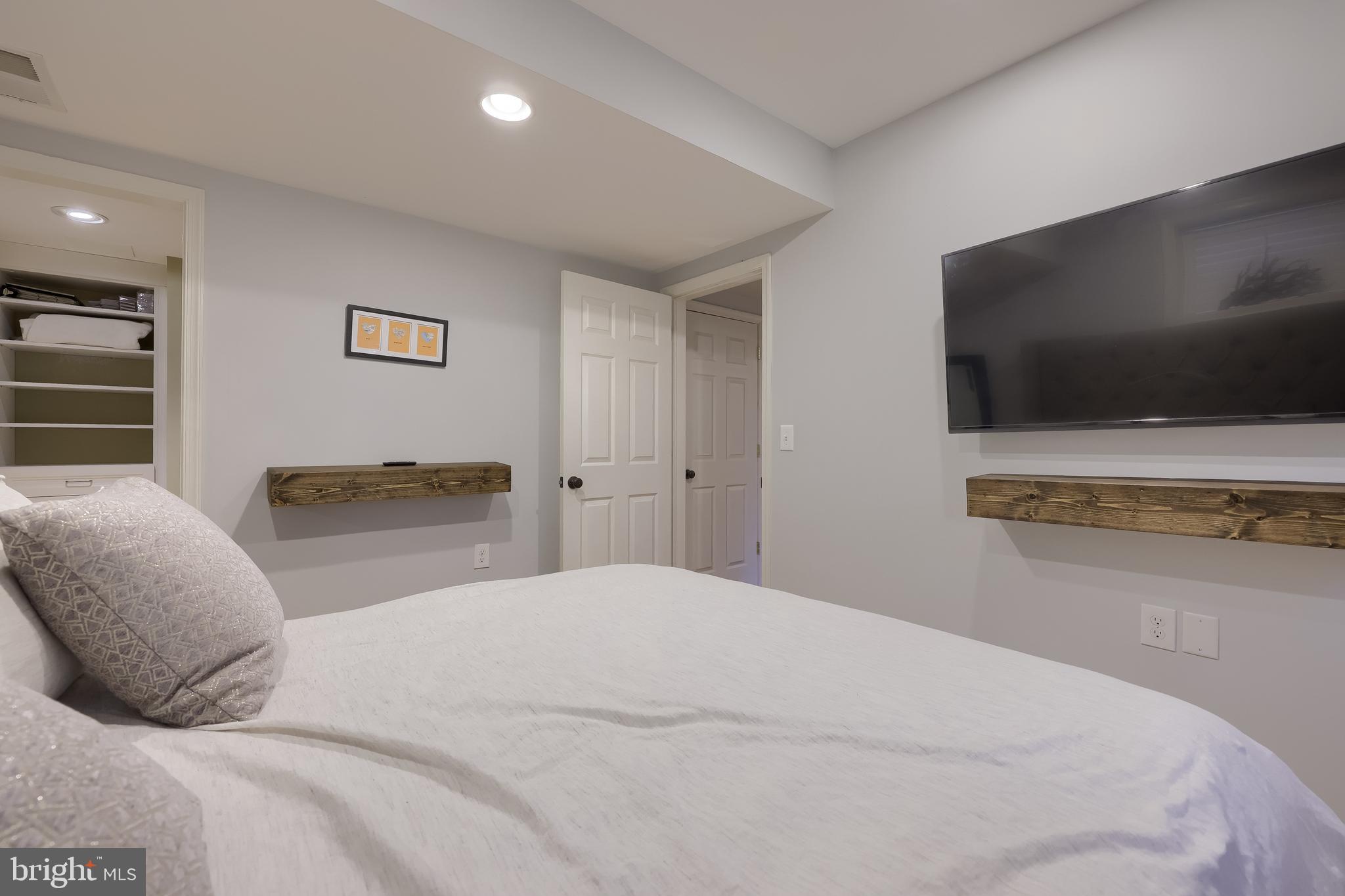 307 Bowyer Lane Lititz, PA 17543 - Photo 44 of 64 a bedroom with a bed and a flat screen tv