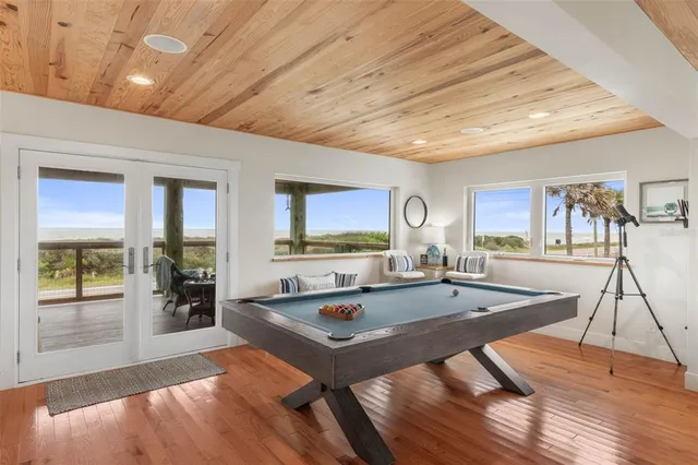a living room with furniture kitchen view and a table