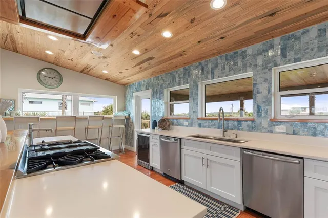 a bathroom with a shower sink and mirror