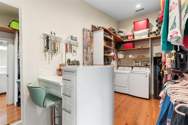 an aerial view of multiple houses with yard