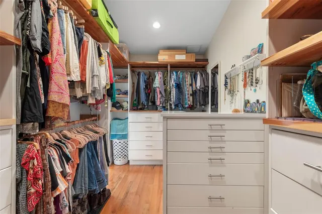 an aerial view of multiple houses with yard