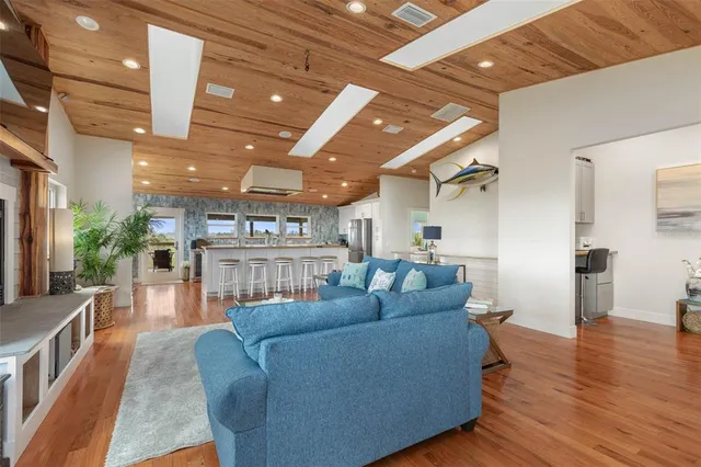 an outdoor living space with patio furniture and city view