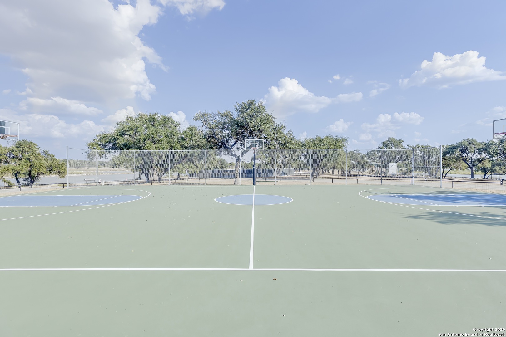 534 Rock Trail Place Spring Branch, TX 78070 - Photo 21 of 27 a view of a swimming pool and a yard