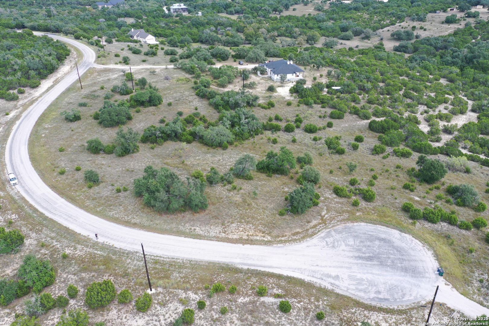 534 Rock Trail Place Spring Branch, TX 78070 - Photo 7 of 27 a view of a wooden house with a park