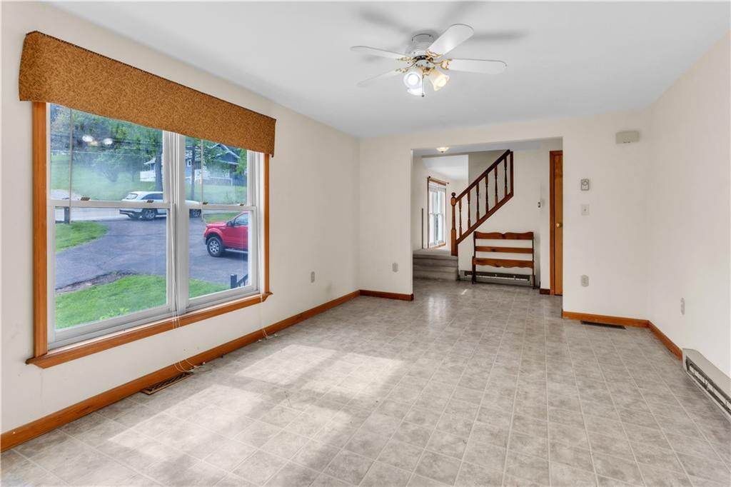1636 Brodhead Road Coraopolis, PA 15108 - Photo 15 of 30 Bathed in natural light from a large window, the family room sits just to the right as you step inside, offering comfort and space to gather.