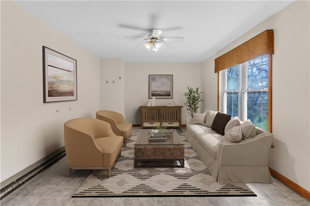 1636 Brodhead Road Coraopolis, PA 15108 - Photo 16 of 30 This digitally staged family room highlights its spacious layout and inviting ambiance.