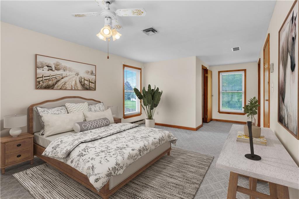1636 Brodhead Road Coraopolis, PA 15108 - Photo 18 of 30 Stylishly staged and thoughtfully designed! This master bedroom offers a spacious walk-in closet and an en-suite primary bathroom for ultimate comfort.
