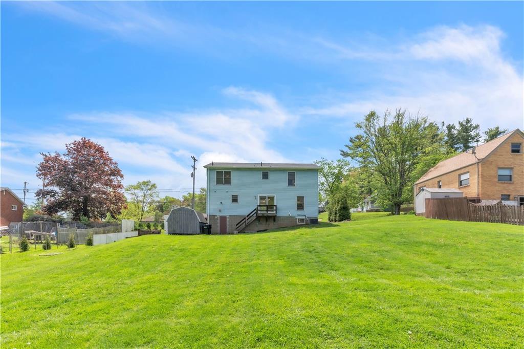 1636 Brodhead Road Coraopolis, PA 15108 - Photo 28 of 30 Spacious outdoor living! The back of the house features a deck off the dining room, a convenient man door from the garage, and a large, flat yard for endless possibilities!