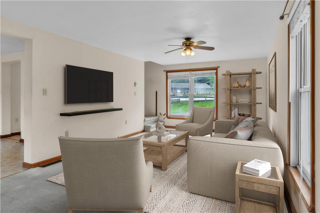 1636 Brodhead Road Coraopolis, PA 15108 - Photo 5 of 30 Designed to inspire! This virtually staged living room highlights its spacious layout and sun-filled charm.