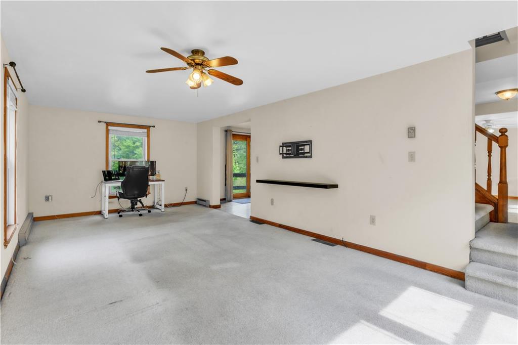 1636 Brodhead Road Coraopolis, PA 15108 - Photo 7 of 30 This inviting living room opens effortlessly into the kitchen, perfect for entertaining.