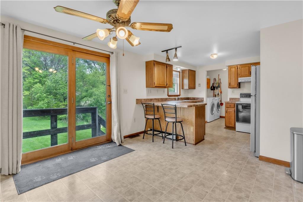 1636 Brodhead Road Coraopolis, PA 15108 - Photo 8 of 30 This kitchen and dining area seamlessly connect to the backyard through stylish sliding doors.