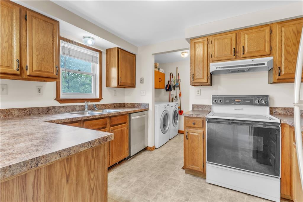 1636 Brodhead Road Coraopolis, PA 15108 - Photo 9 of 30 Convenience meets efficiency! This laundry room, just off the kitchen, offers easy access and smart functionality.