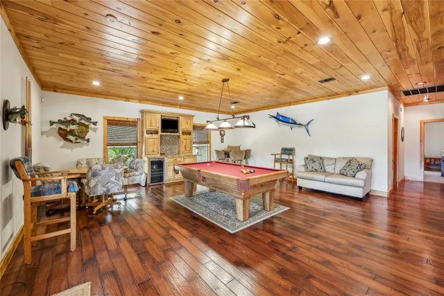 a room with furniture and wooden floor