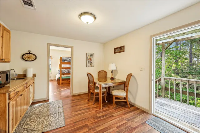 a spacious bedroom with a bed and a large window