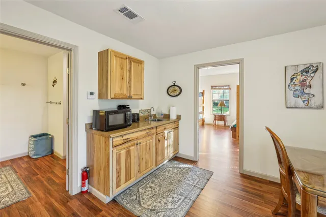 a spacious bathroom with a double vanity sink and a mirror