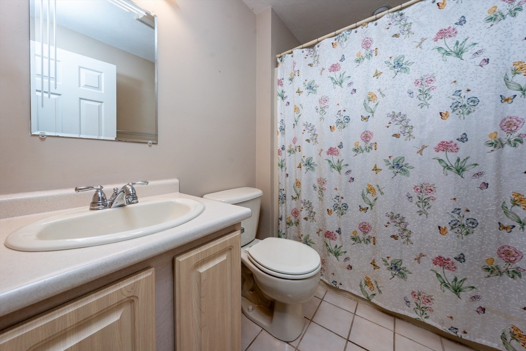 50 Pine Hill Boulevard, Unit 46 Mashpee, MA 02649 - Photo 15 of 19 a bathroom with a sink toilet and mirror