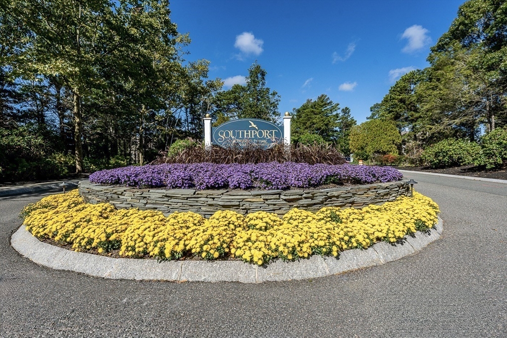 50 Pine Hill Boulevard, Unit 46 Mashpee, MA 02649 - Photo 19 of 19 a view of a swimming pool with a yard