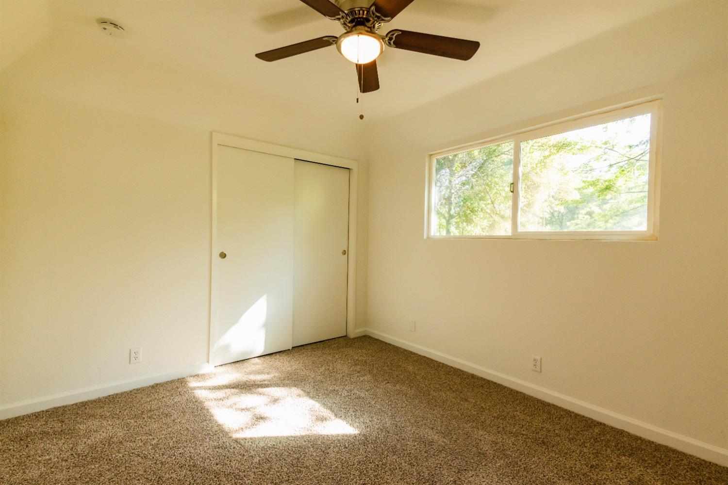 31838 Comanche Road Coarsegold, CA 93614 - Photo 14 of 19 a view of an empty room and window