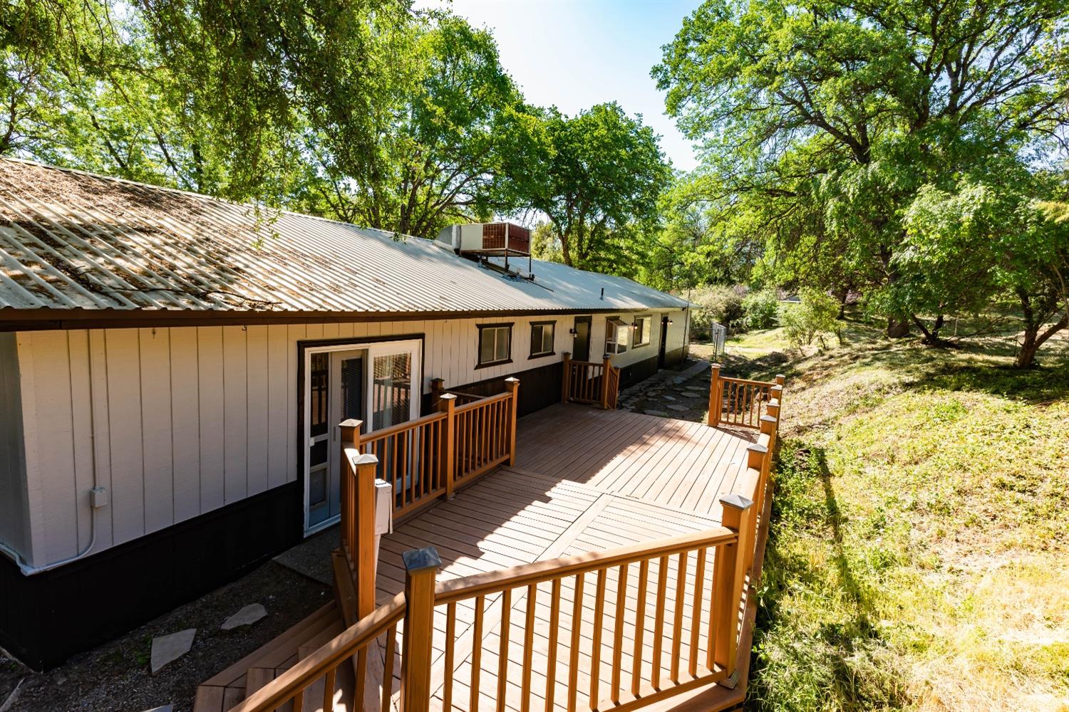 31838 Comanche Road Coarsegold, CA 93614 - Photo 18 of 19 a view of a wooden deck and a backyard