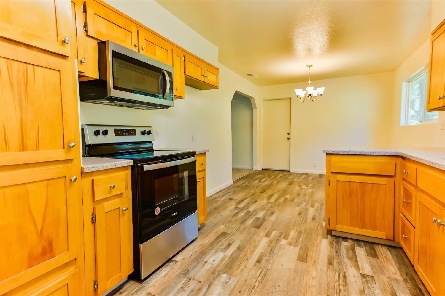 31838 Comanche Road Coarsegold, CA 93614 - Photo 19 of 19 a kitchen with stainless steel appliances granite countertop a stove and a microwave