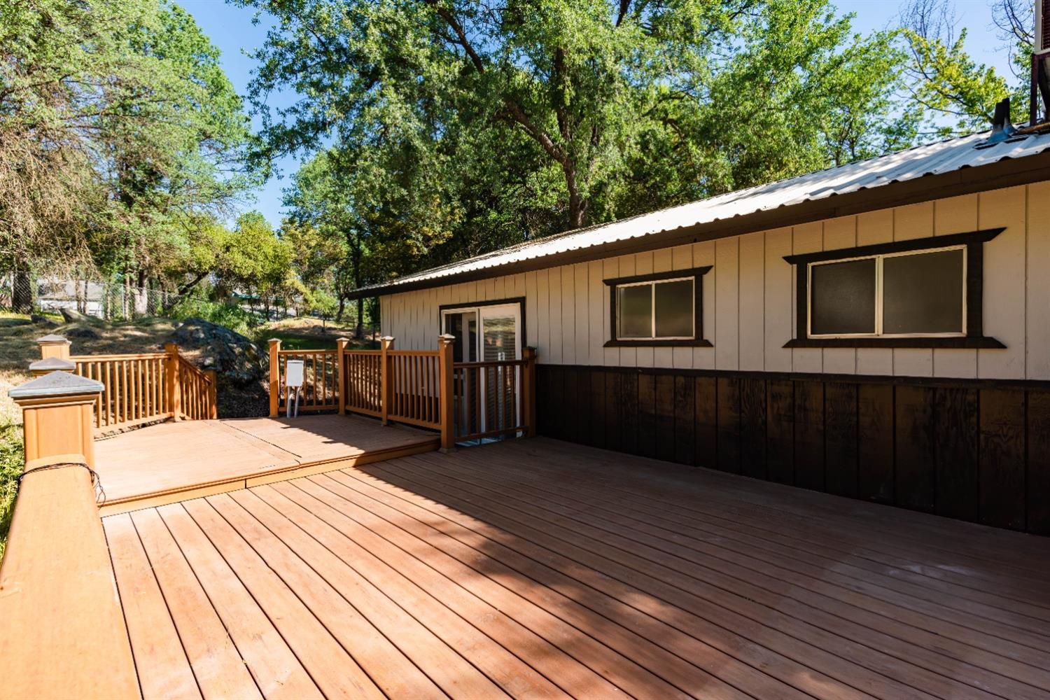 31838 Comanche Road Coarsegold, CA 93614 - Photo 3 of 19 a backyard of a house with wooden floor and seating space
