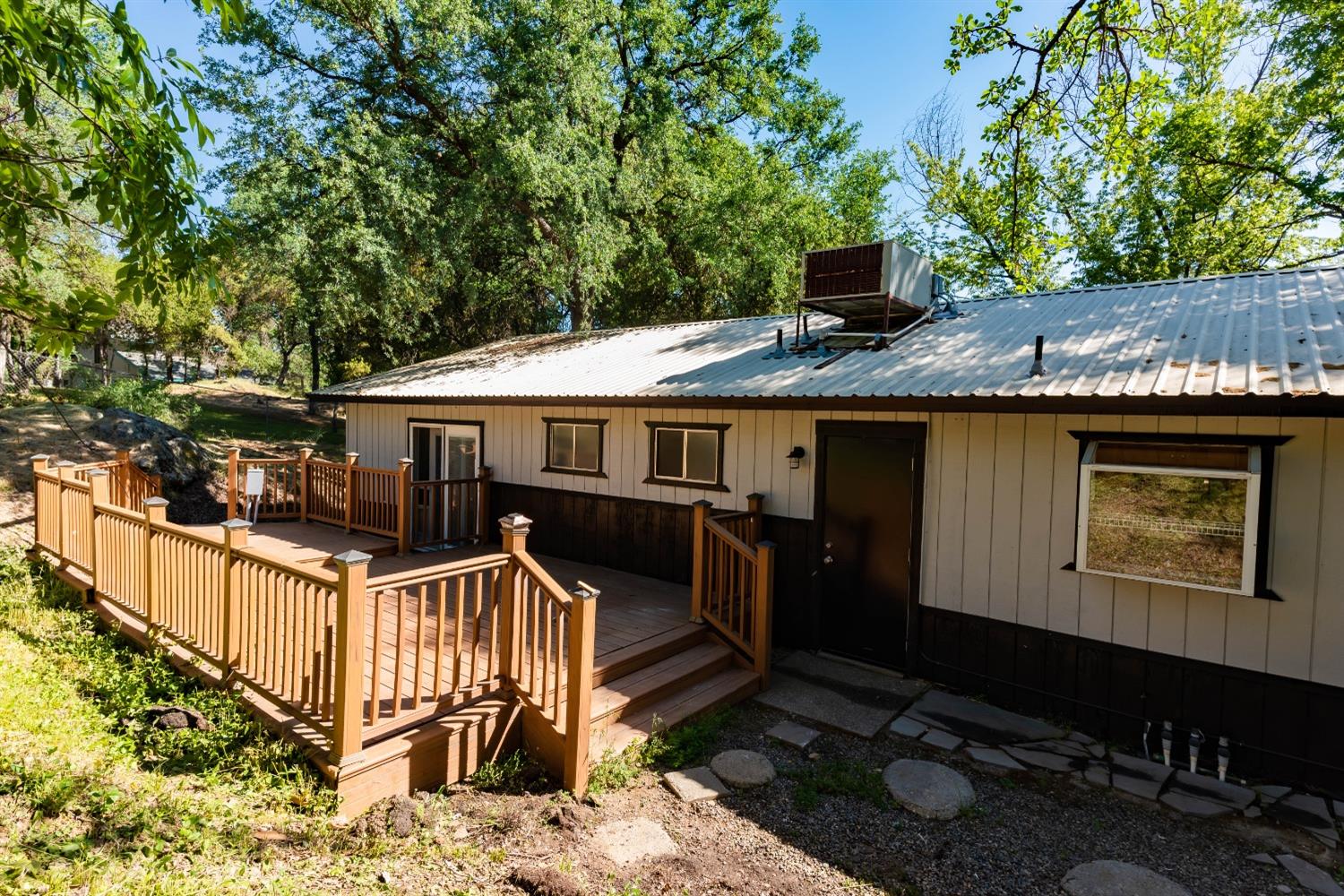 31838 Comanche Road Coarsegold, CA 93614 - Photo 5 of 19 a front view of house with yard outdoor seating and barbeque oven