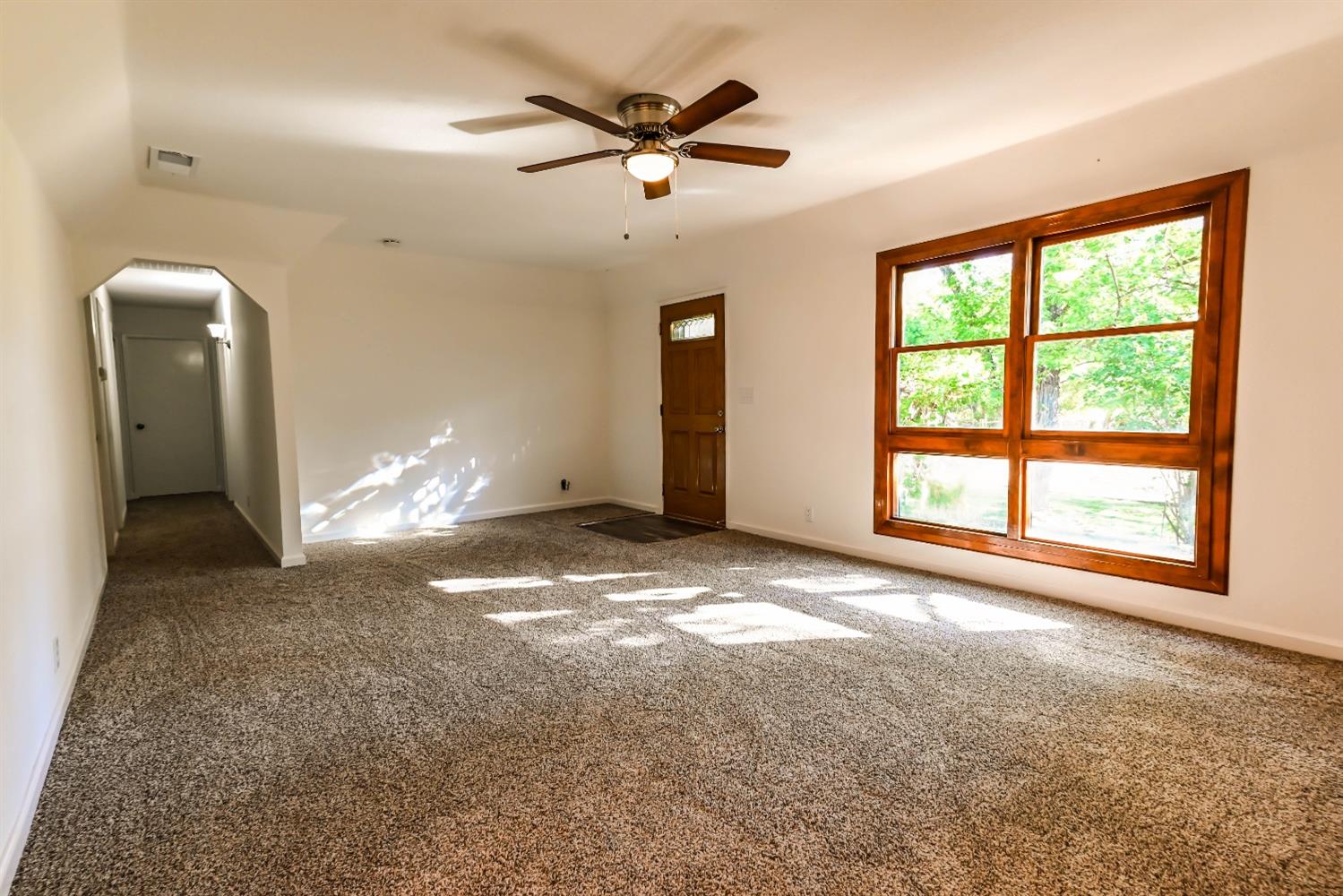 31838 Comanche Road Coarsegold, CA 93614 - Photo 7 of 19 a view of a livingroom with a ceiling fan and window